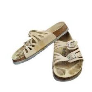 White Birkenstock Granada soft footbed sandals with adjustable buckle straps.